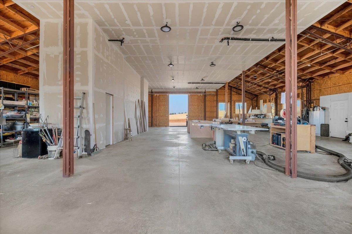22654 Cobblestone Lane Sanger, CA 93657 - Photo 51 of 64 a view of a livingroom with table and chairs