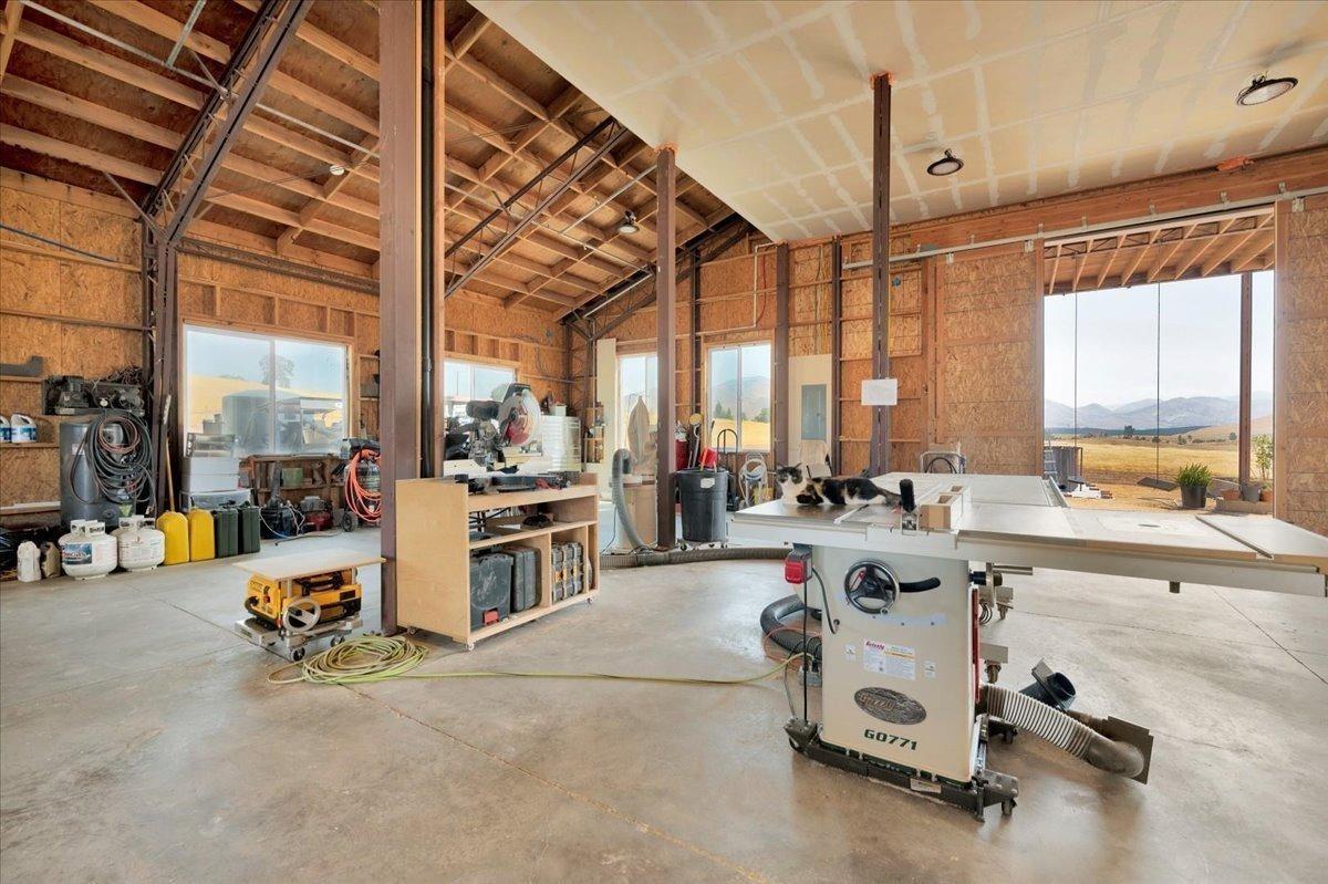 22654 Cobblestone Lane Sanger, CA 93657 - Photo 53 of 64 a room with gym equipment and a large window