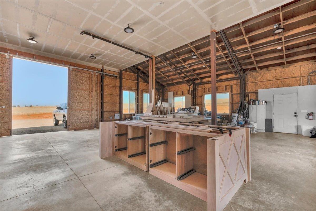 22654 Cobblestone Lane Sanger, CA 93657 - Photo 54 of 64 a kitchen with a stove and a sink