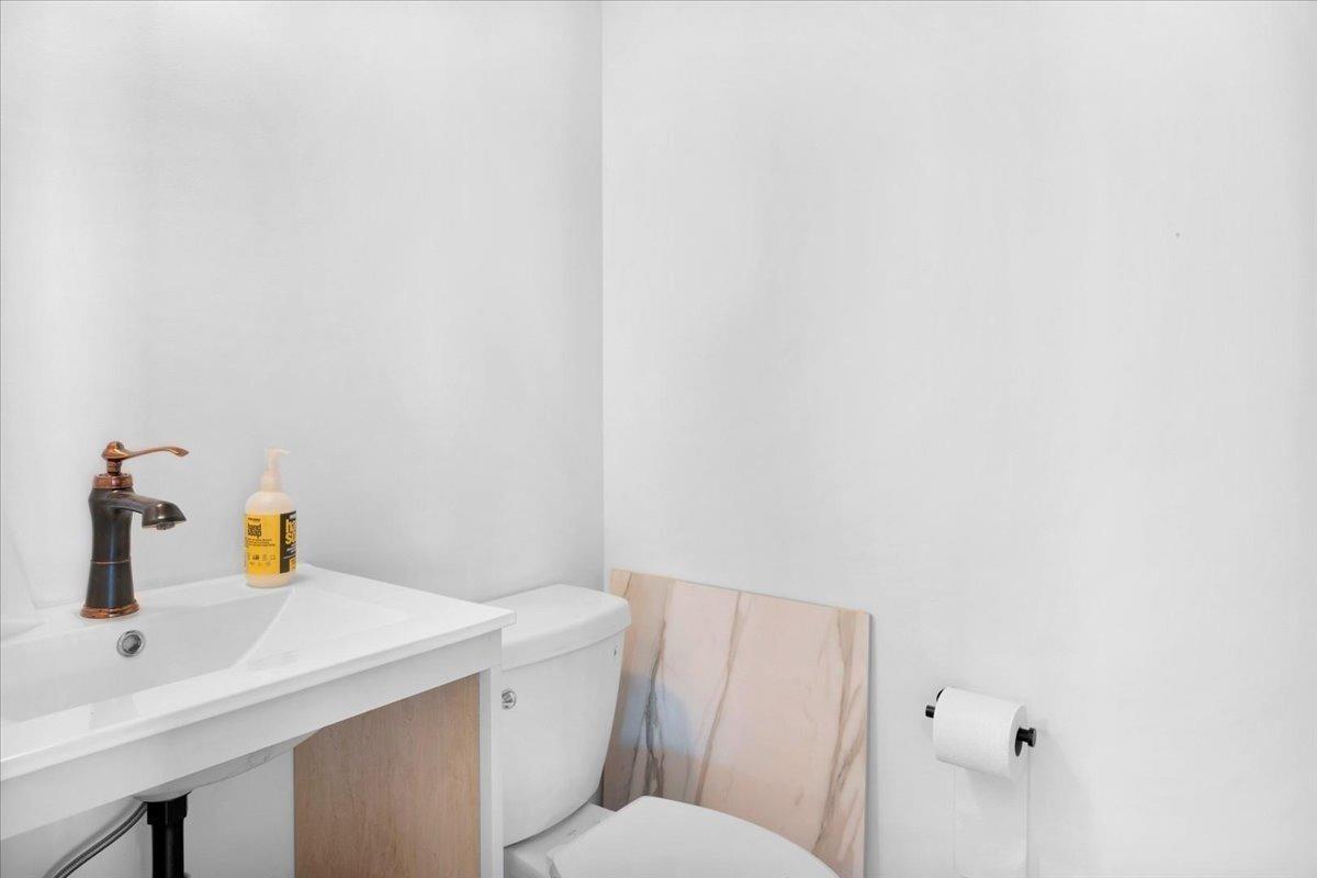 22654 Cobblestone Lane Sanger, CA 93657 - Photo 58 of 64 a bathroom with a sink a toilet and vanity