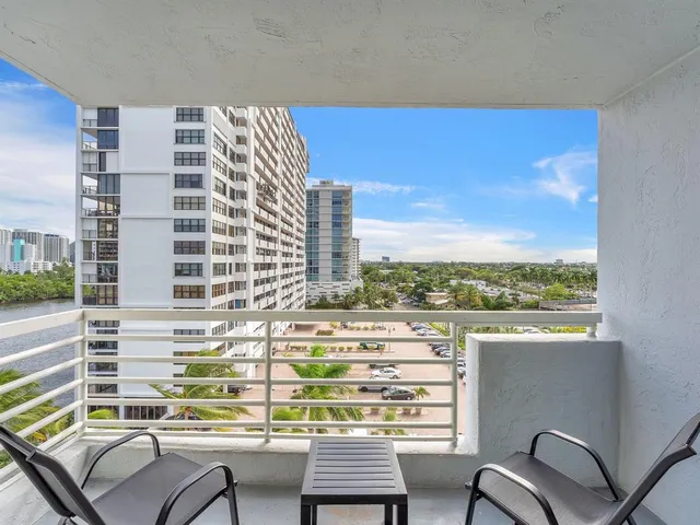 a view of a balcony with a chair and table
