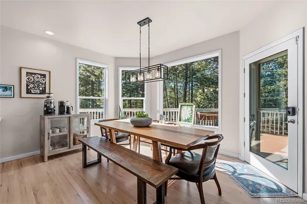 a dining room with furniture window wooden floor