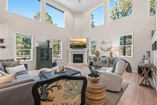 a living room with furniture fireplace and flat screen tv
