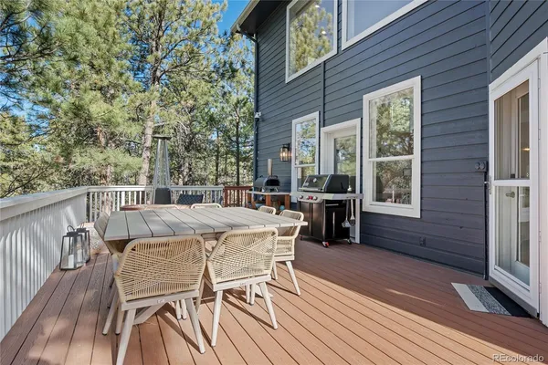 a view of a city from a dining room with furniture window and outside view