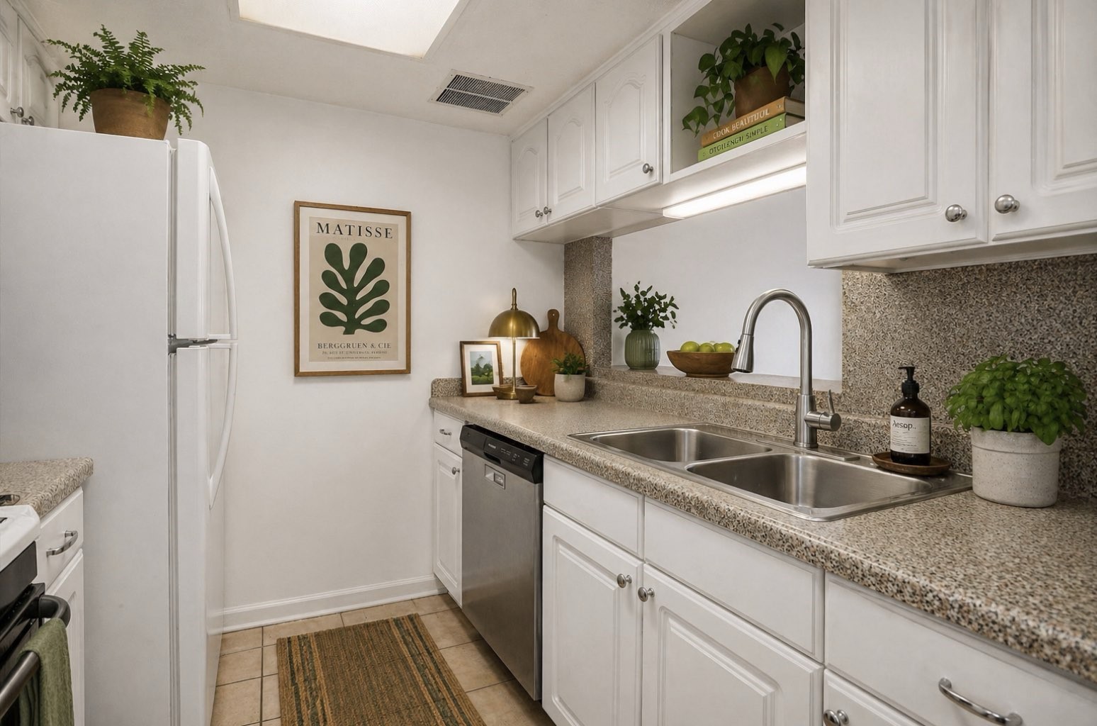 9541 Clanton Street Houston, TX 77080 - Photo 12 of 44 a kitchen with a sink and a refrigerator