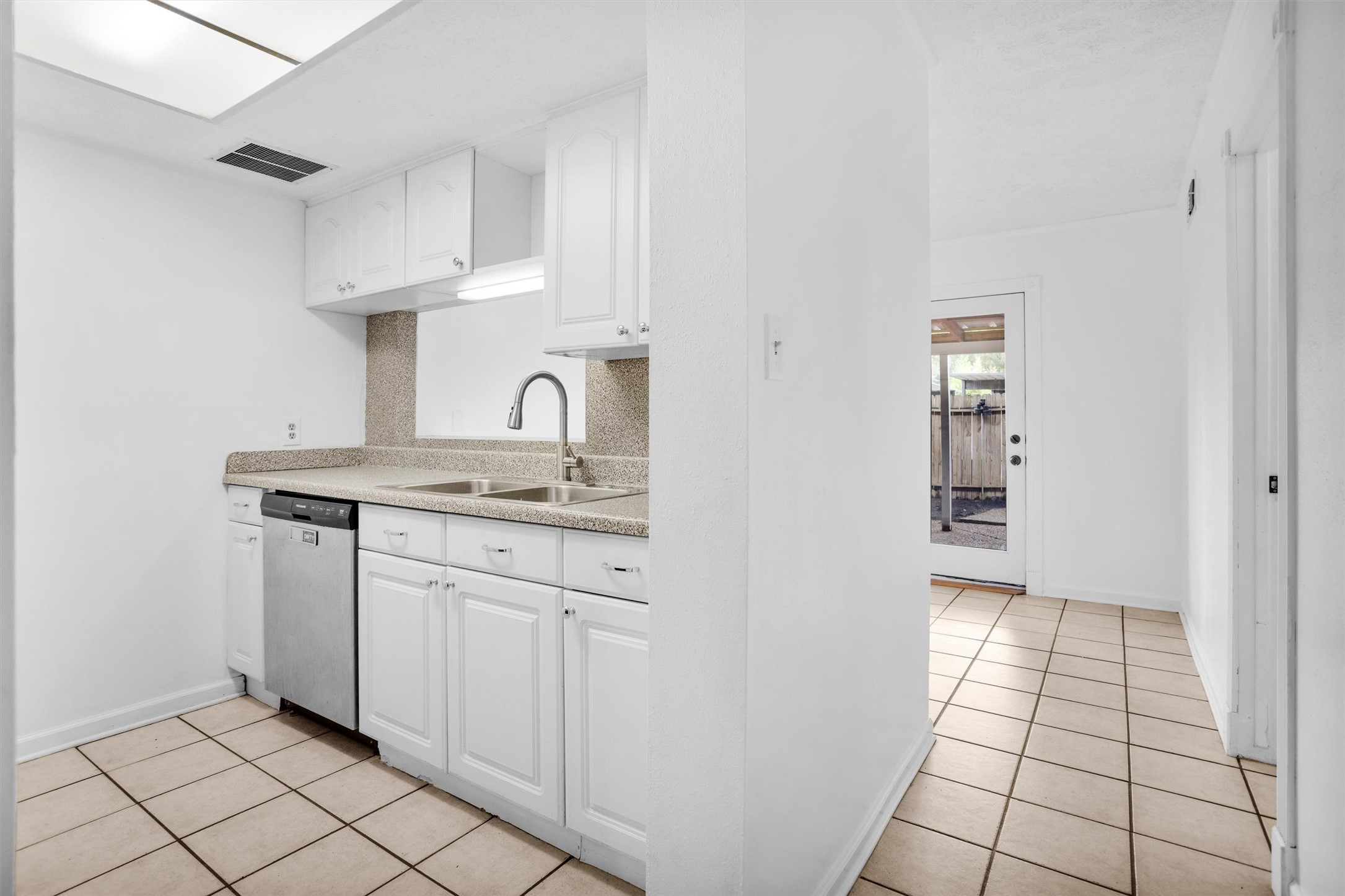 9541 Clanton Street Houston, TX 77080 - Photo 14 of 44 a kitchen with a sink and cabinets