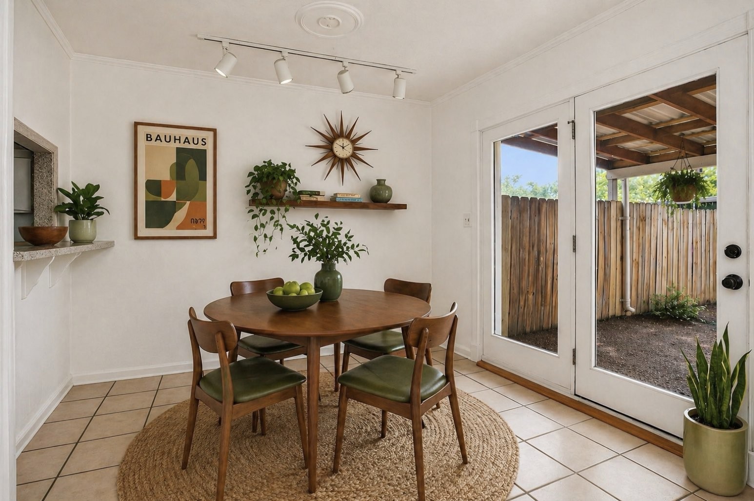 9541 Clanton Street Houston, TX 77080 - Photo 15 of 44 a view of a dining room with furniture and a potted plant