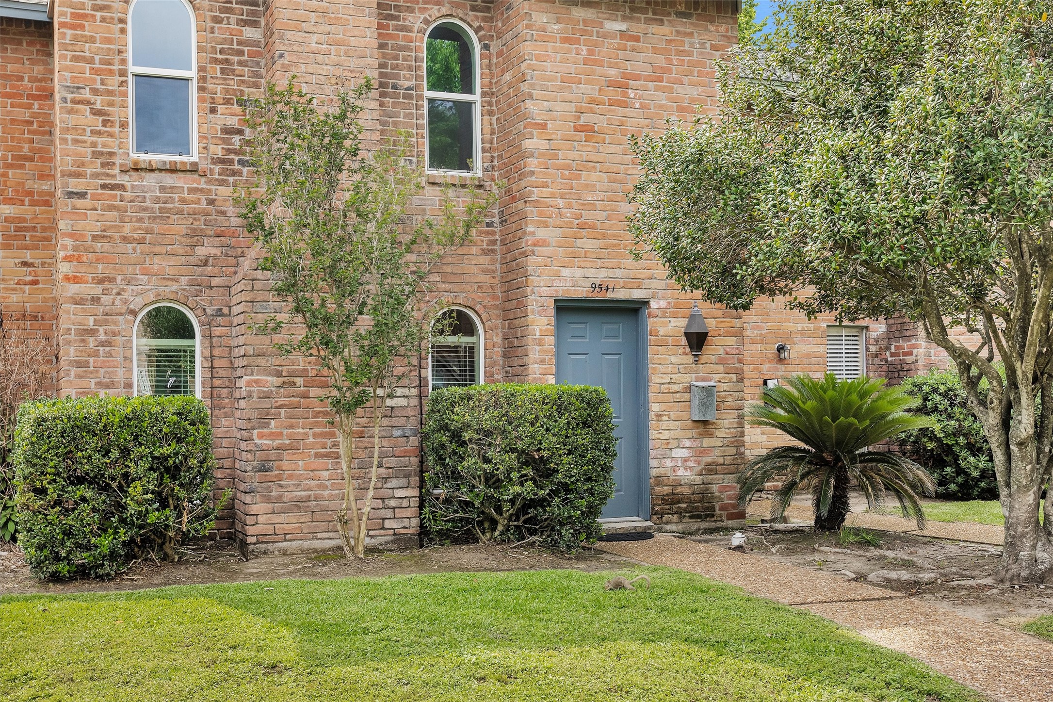 9541 Clanton Street Houston, TX 77080 - Photo 2 of 44 a front view of a house with garden