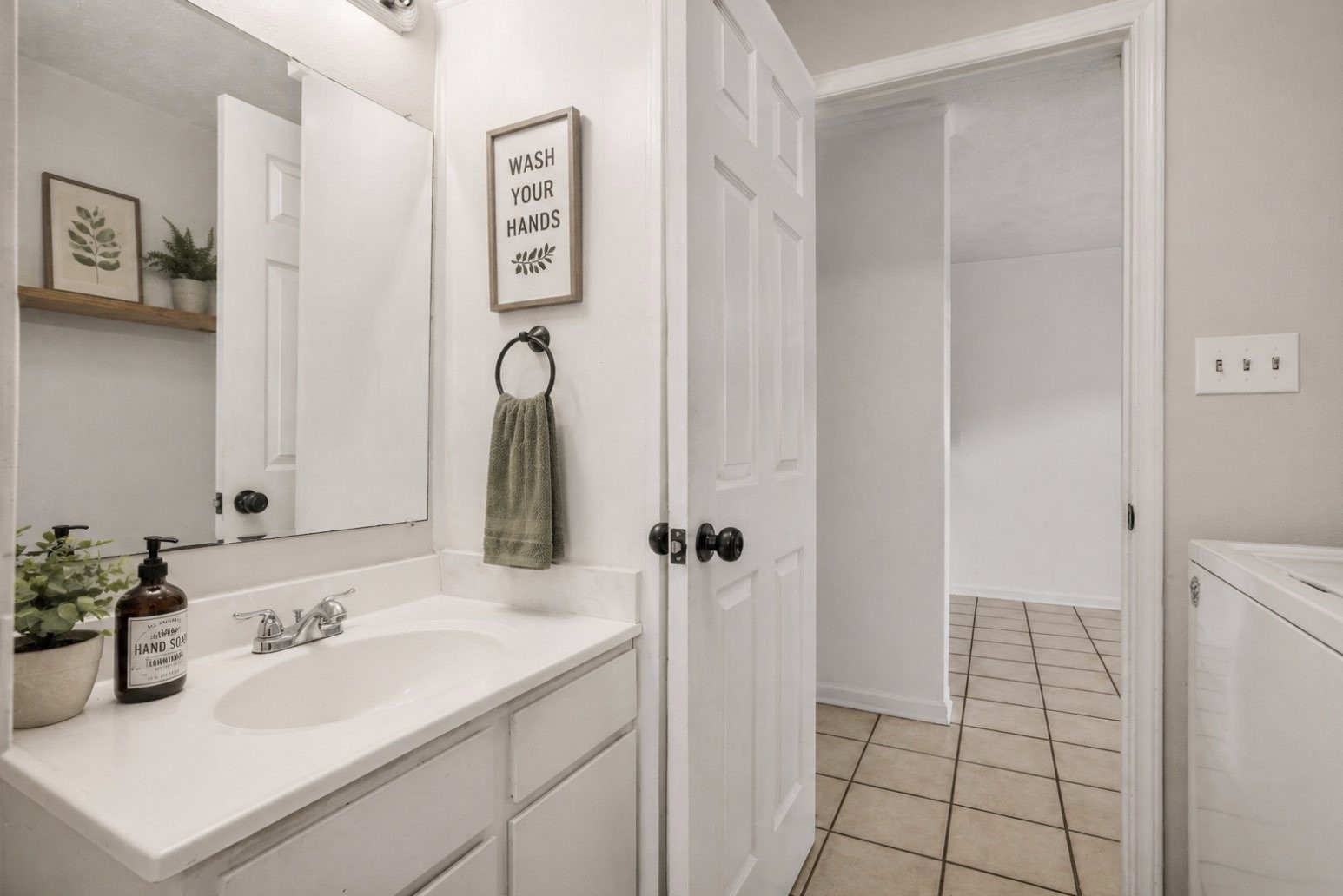 9541 Clanton Street Houston, TX 77080 - Photo 22 of 44 a bathroom with a sink and a mirror