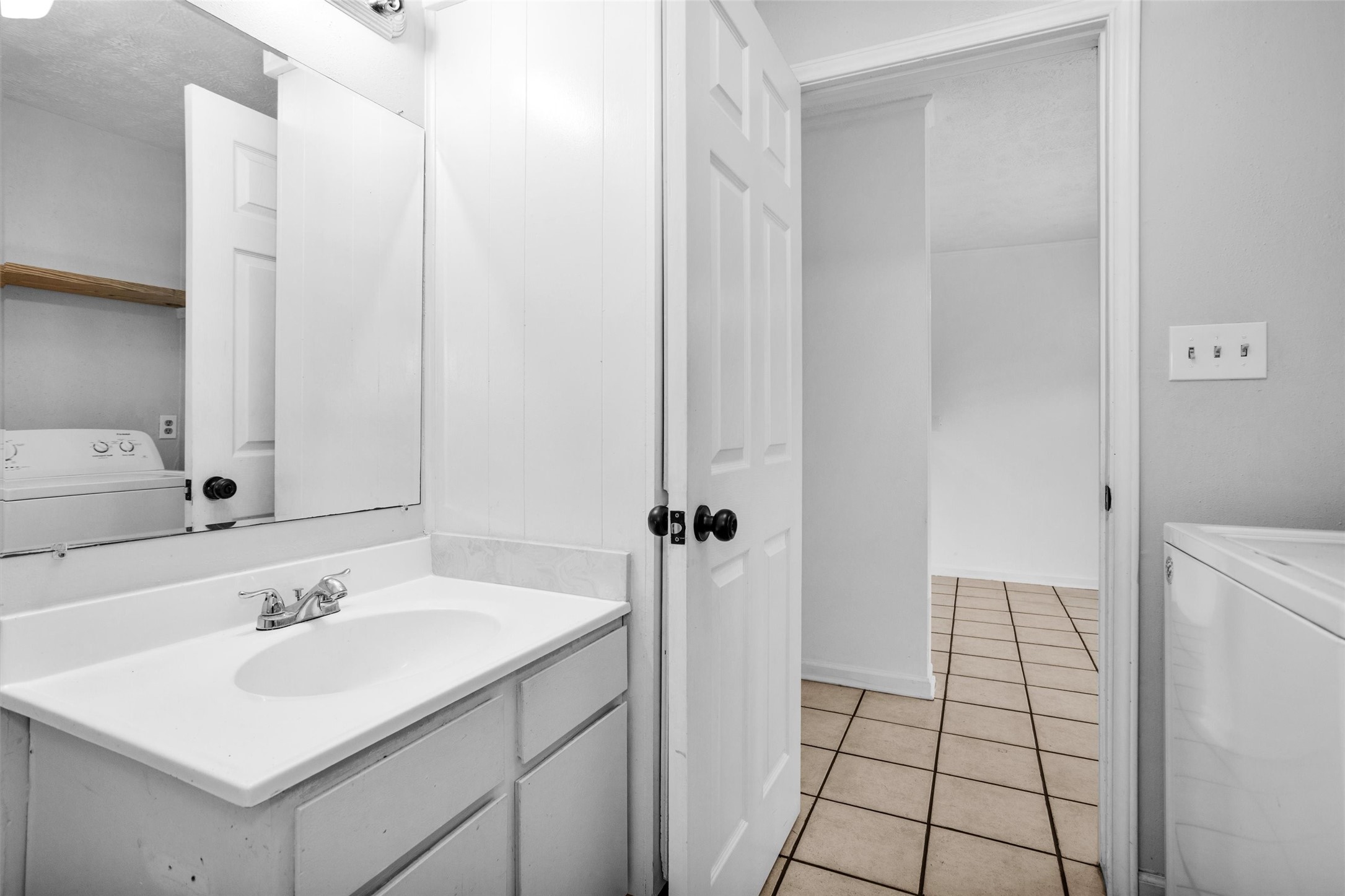 9541 Clanton Street Houston, TX 77080 - Photo 23 of 44 a bathroom with a sink a toilet and a mirror