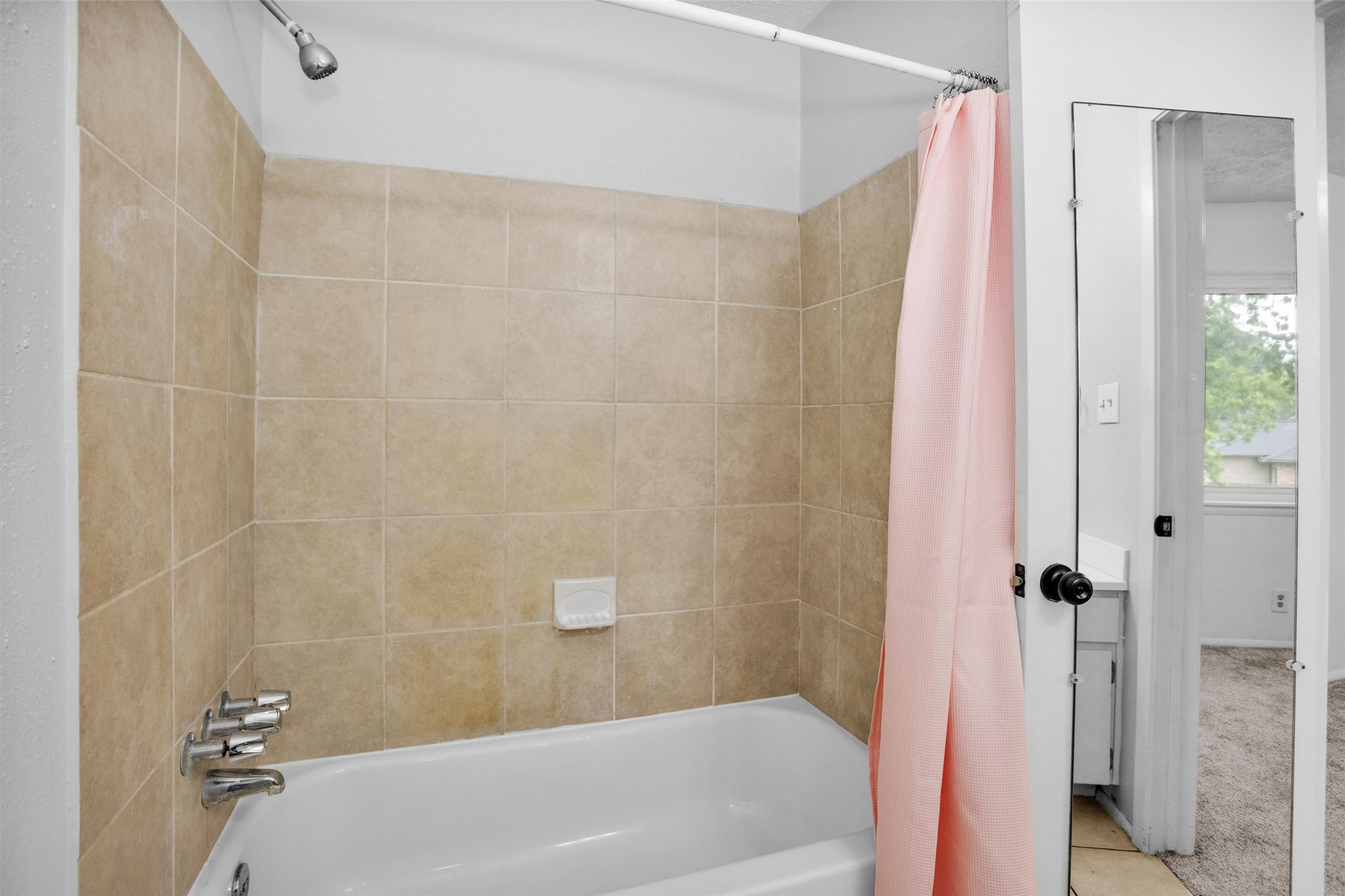 9541 Clanton Street Houston, TX 77080 - Photo 30 of 44 a bath tub sitting next to a white toilet