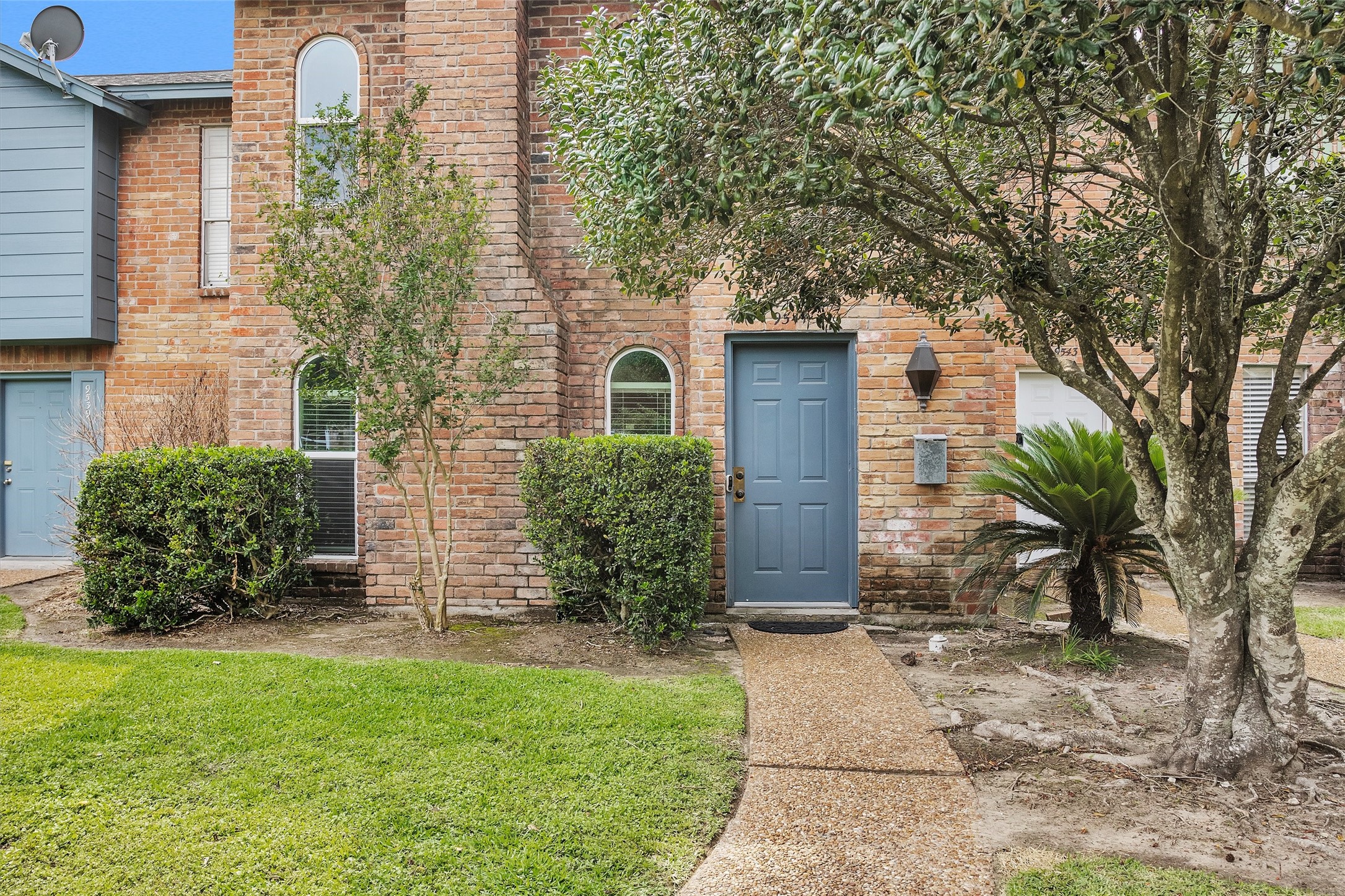 9541 Clanton Street Houston, TX 77080 - Photo 3 of 44 a front view of a house with garden