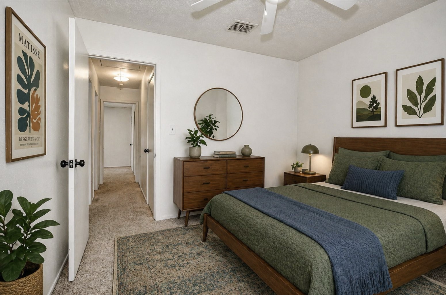 9541 Clanton Street Houston, TX 77080 - Photo 32 of 44 a bedroom with a bed and a potted plant