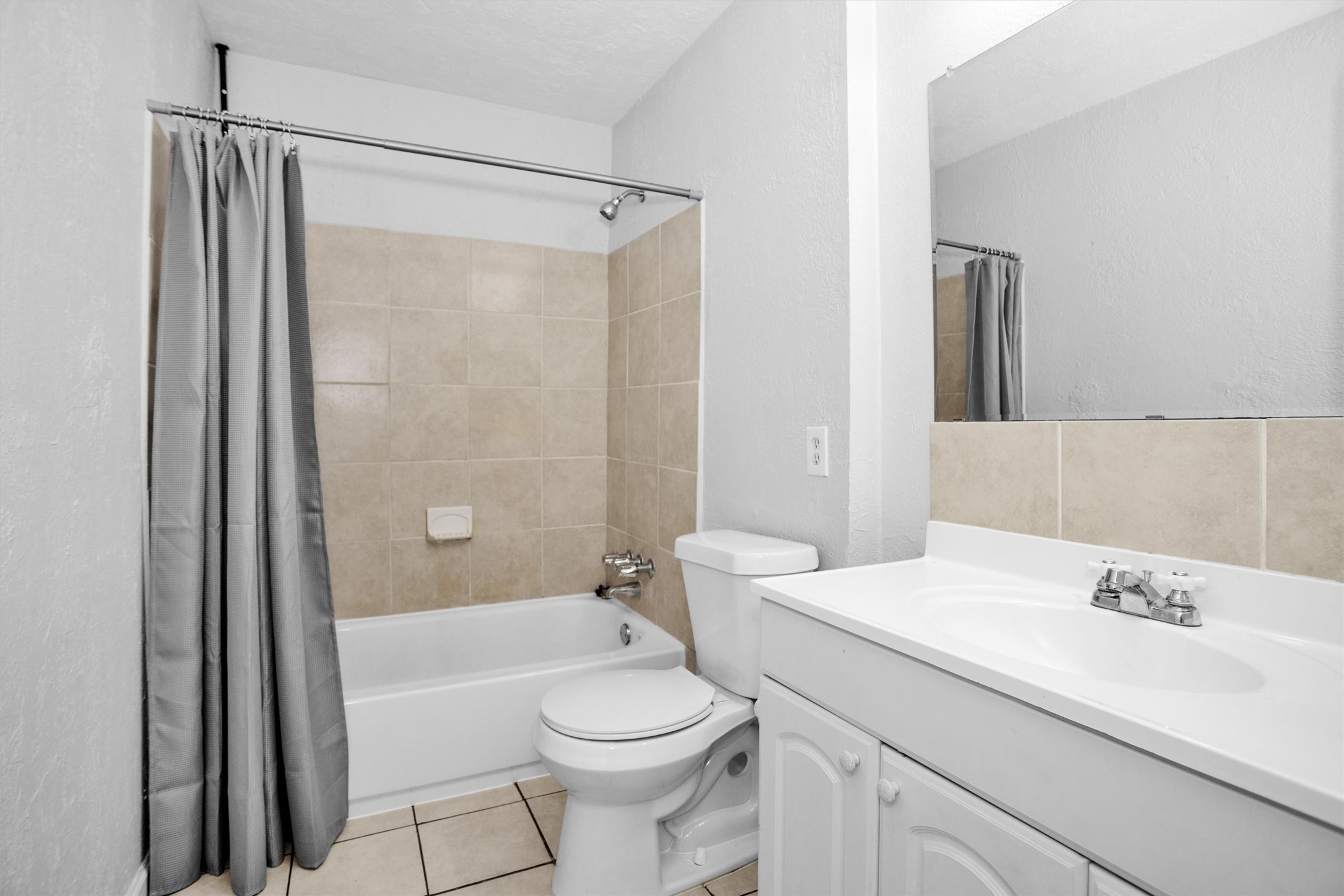 9541 Clanton Street Houston, TX 77080 - Photo 35 of 44 a bathroom with a sink mirror vanity and toilet