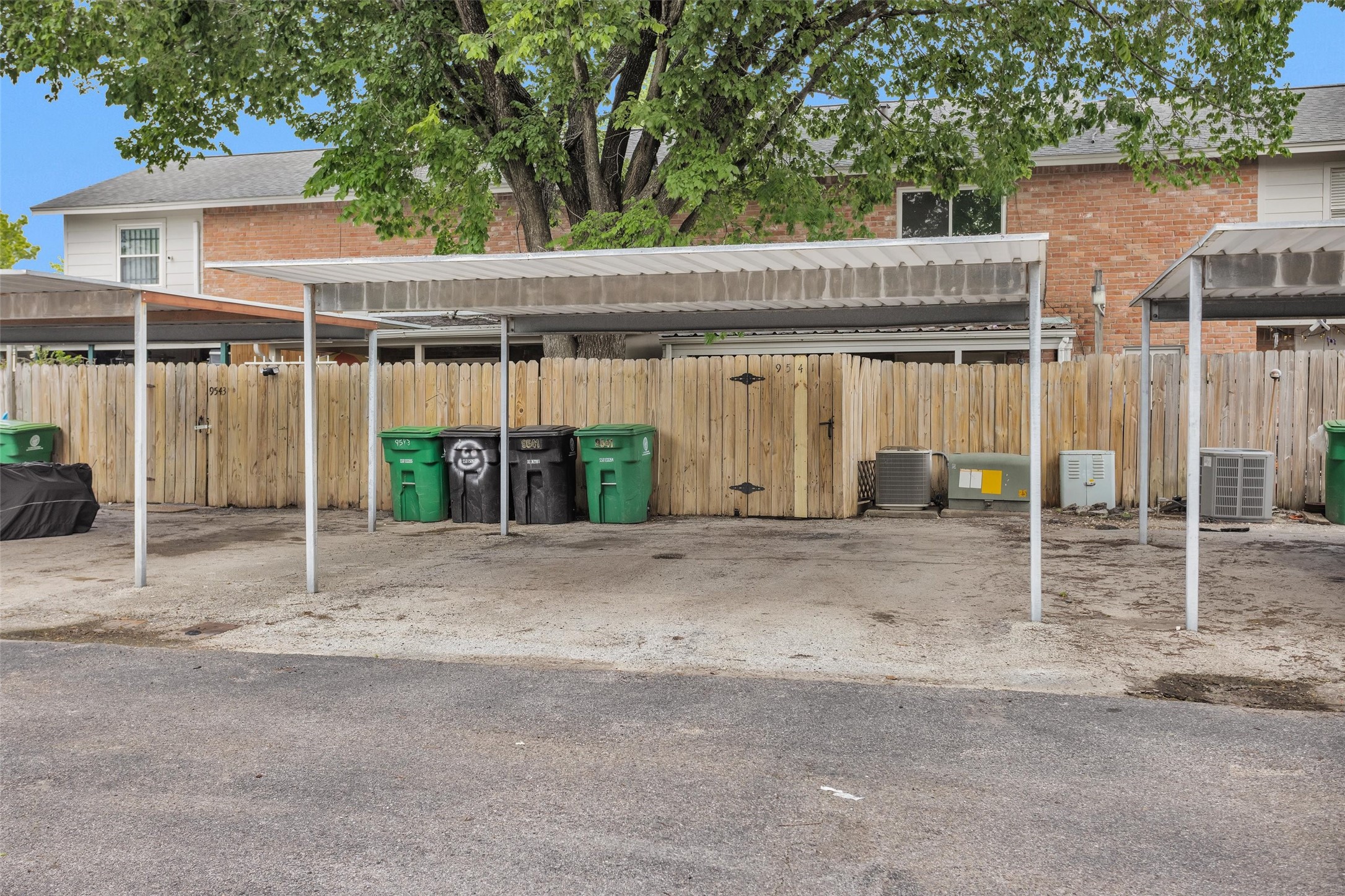 9541 Clanton Street Houston, TX 77080 - Photo 43 of 44 a view of a house with a backyard and garage