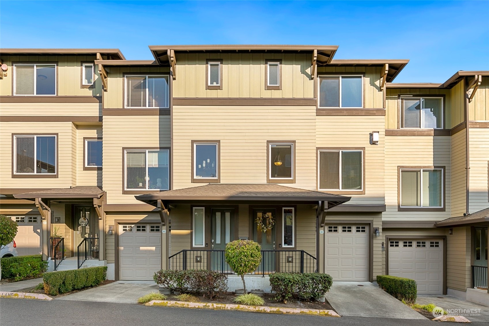 2115 201st Place Southeast, Unit B3 Bothell, WA 98012 - Photo 1 of 25 a front view of a residential apartment building with a yard