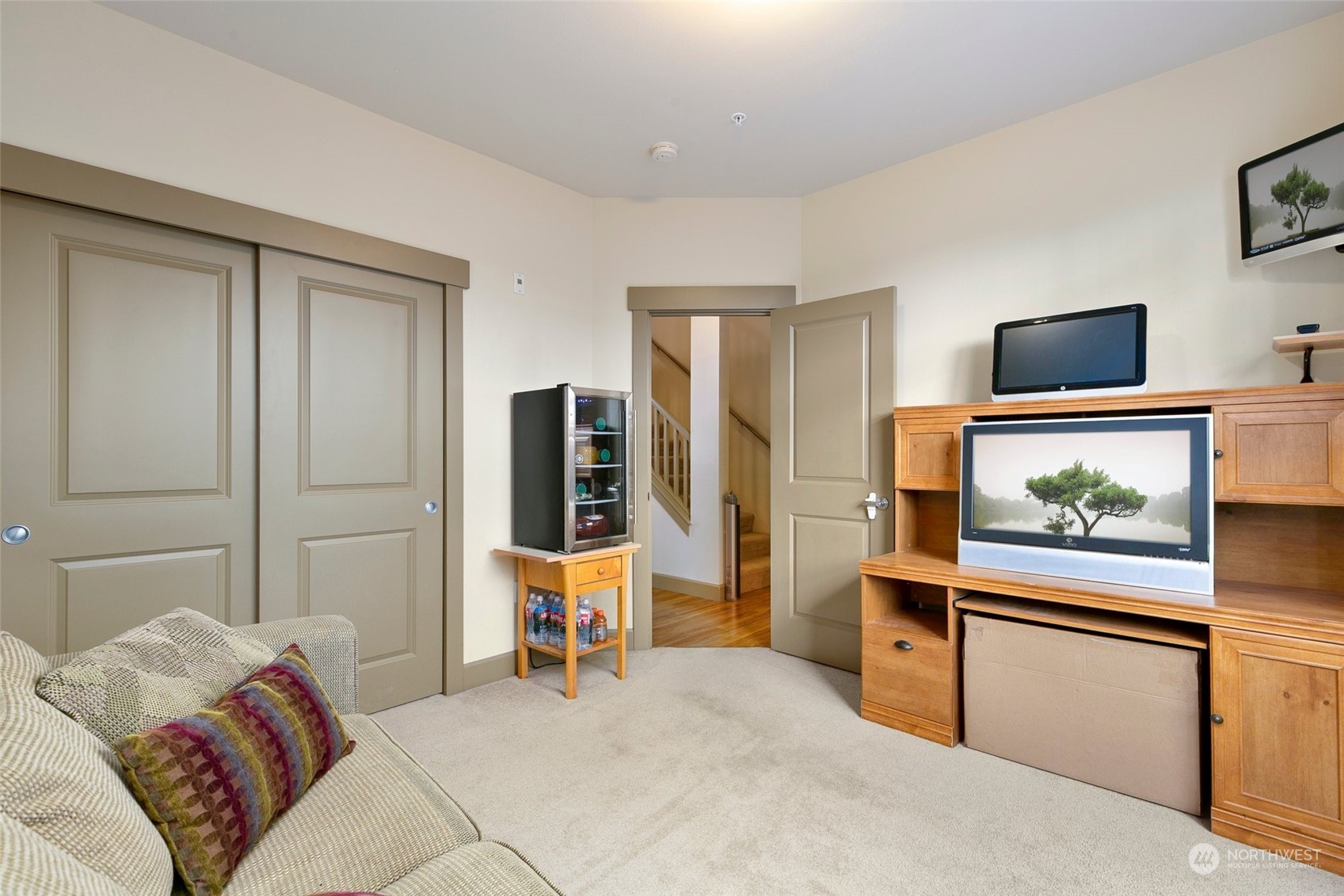 2115 201st Place Southeast, Unit B3 Bothell, WA 98012 - Photo 13 of 25 a living room with furniture and a flat screen tv