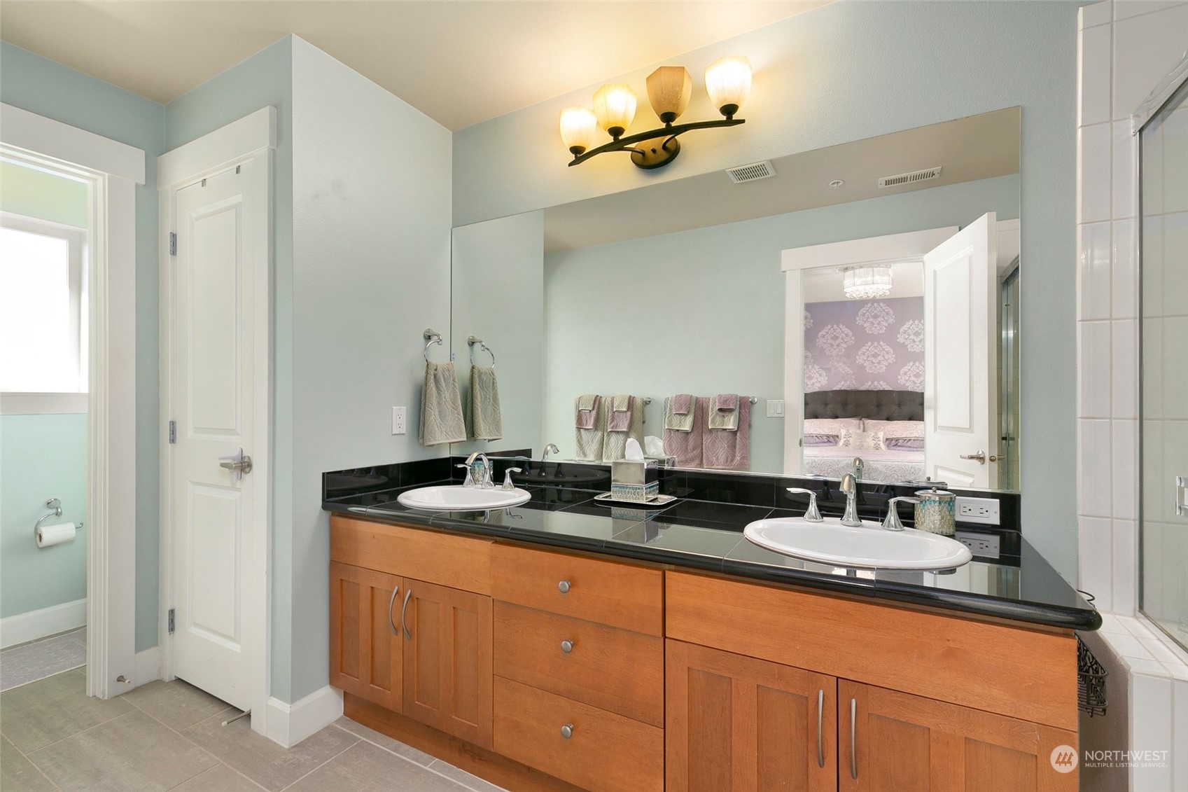 2115 201st Place Southeast, Unit B3 Bothell, WA 98012 - Photo 18 of 25 a bathroom with double sink and a mirror