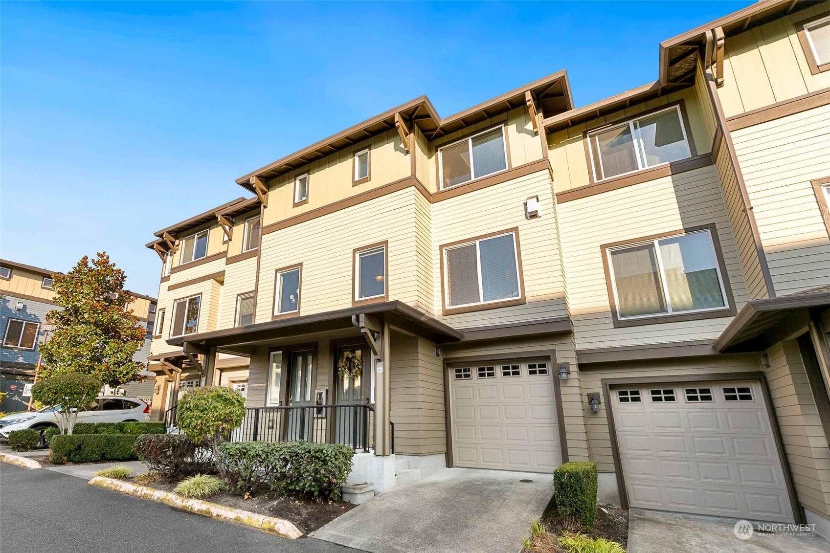 2115 201st Place Southeast, Unit B3 Bothell, WA 98012 - Photo 2 of 25 a front view of a residential houses with yard