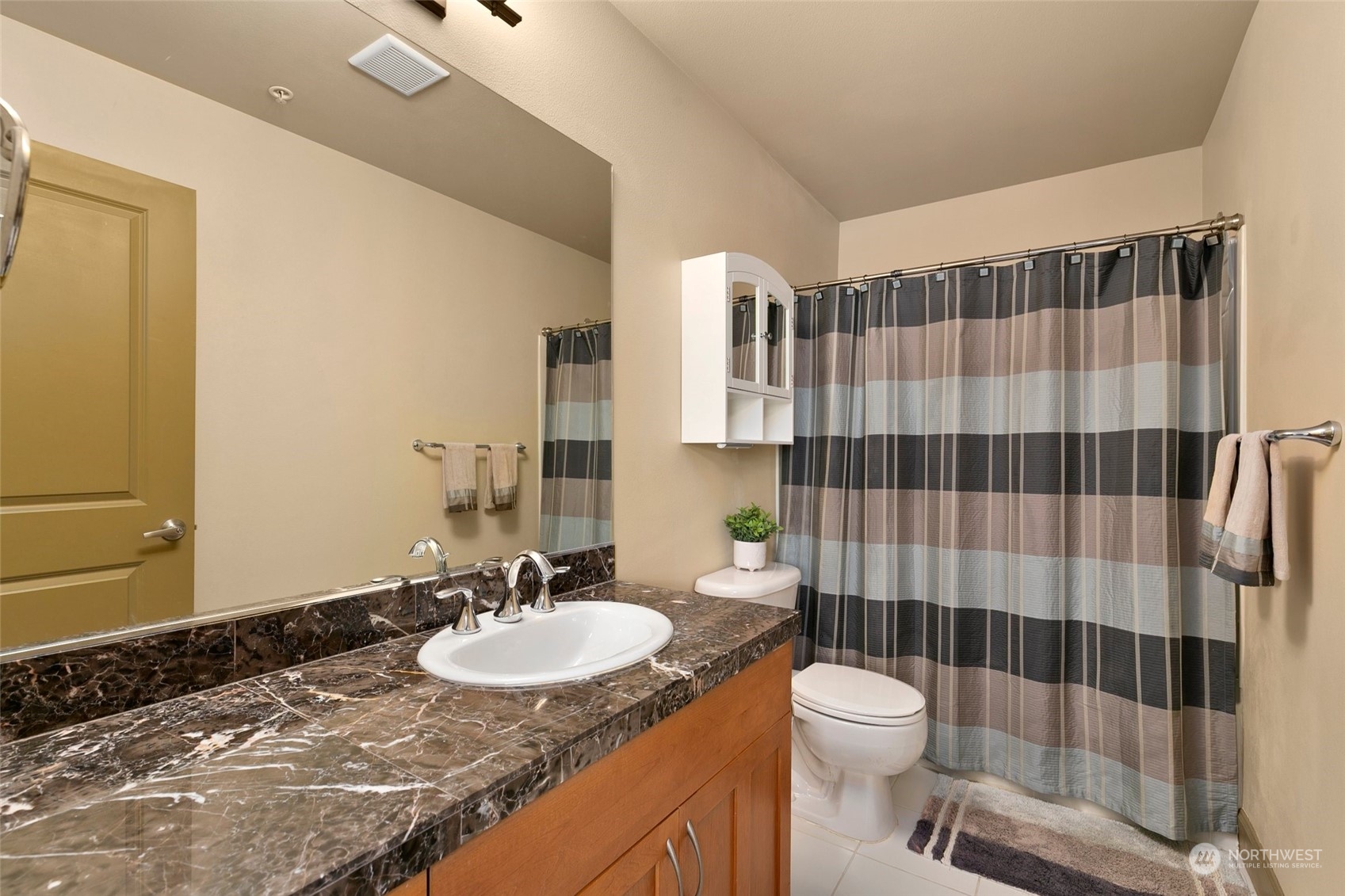 2115 201st Place Southeast, Unit B3 Bothell, WA 98012 - Photo 23 of 25 a bathroom with a sink toilet and shower