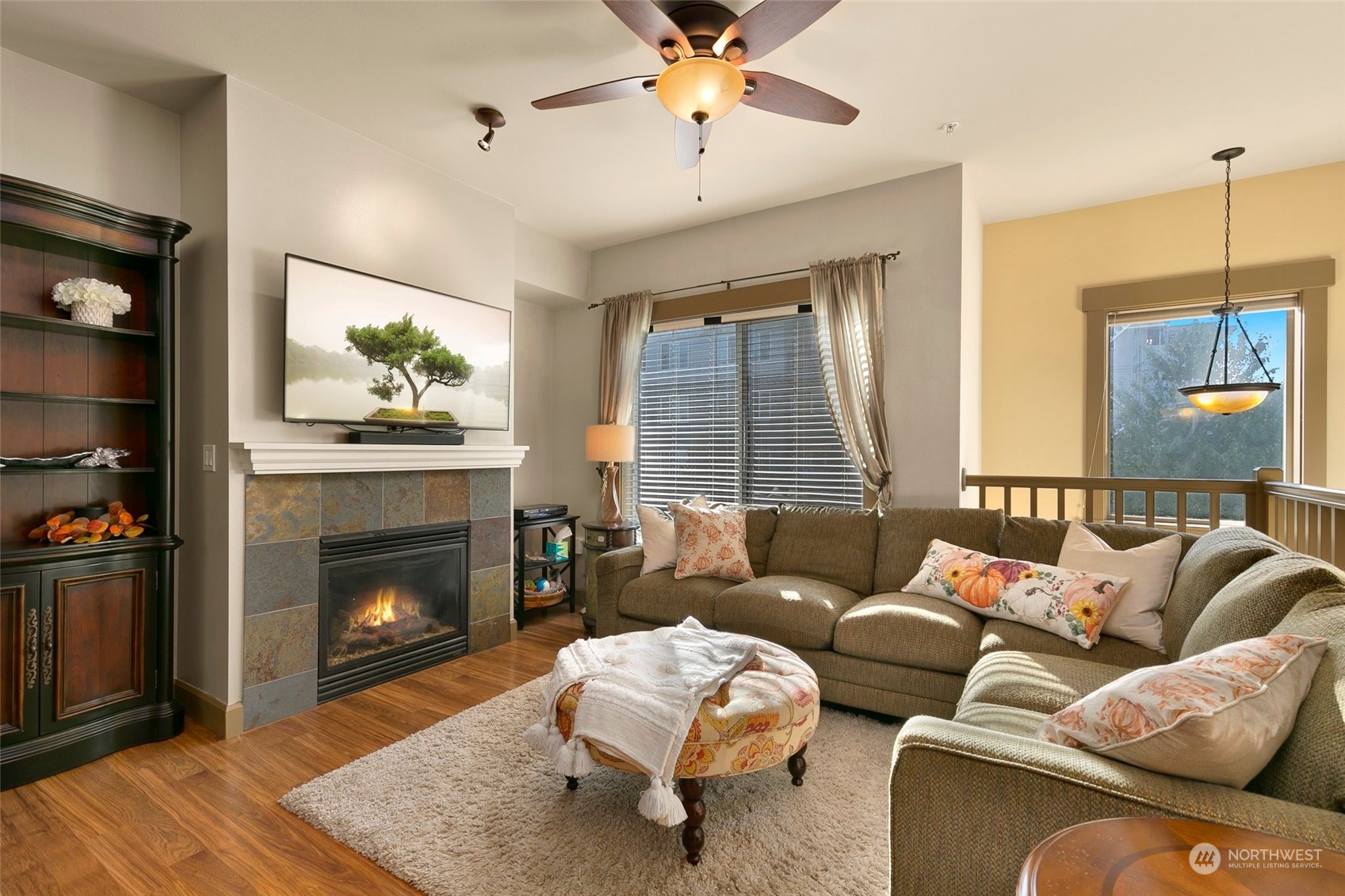 2115 201st Place Southeast, Unit B3 Bothell, WA 98012 - Photo 5 of 25 a living room with furniture and a fireplace