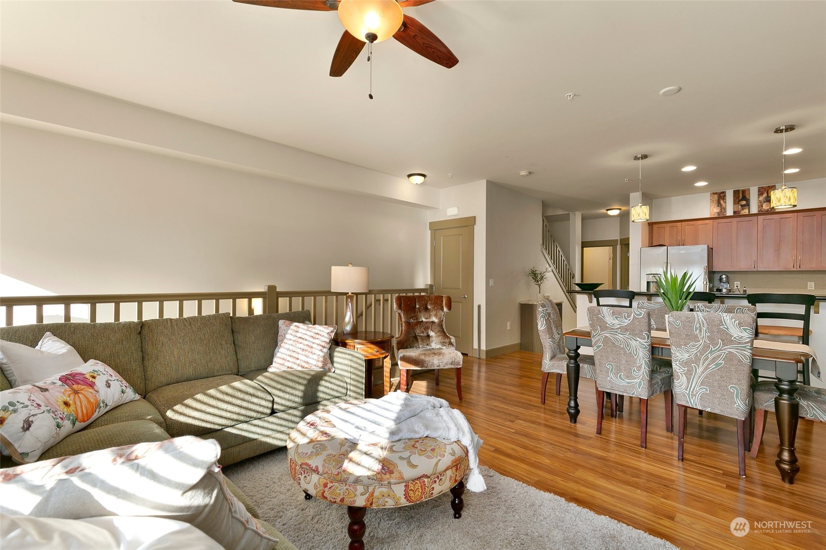 2115 201st Place Southeast, Unit B3 Bothell, WA 98012 - Photo 6 of 25 a living room with furniture and wooden floor