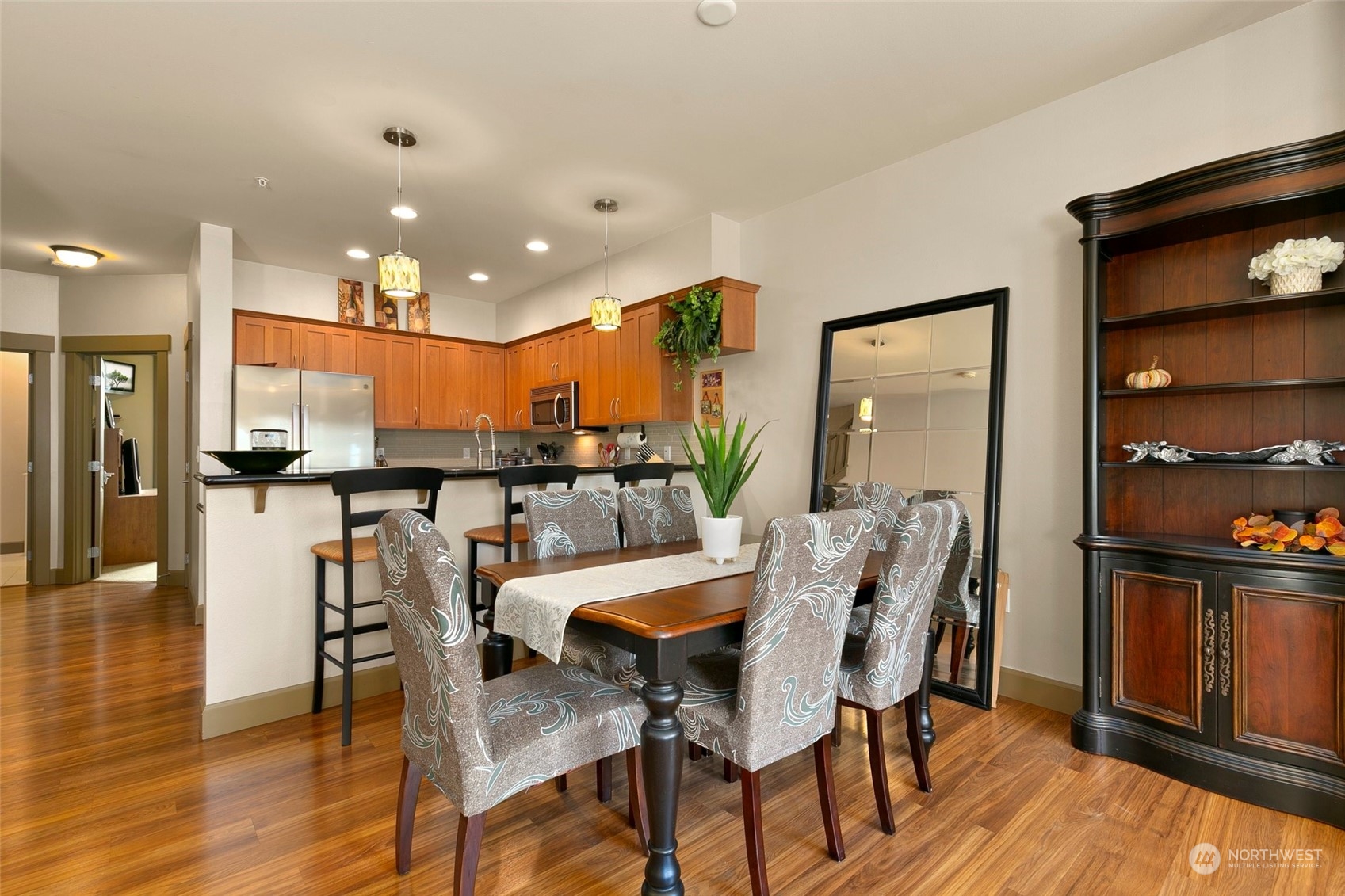 2115 201st Place Southeast, Unit B3 Bothell, WA 98012 - Photo 7 of 25 a view of a dining room with furniture and wooden floor
