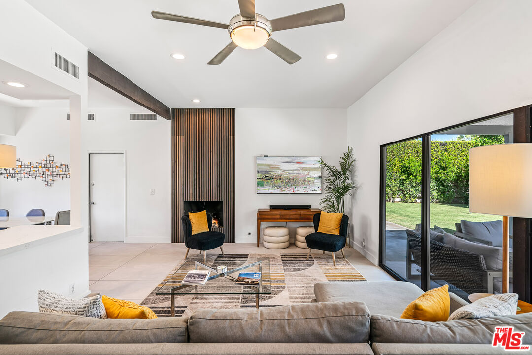 544 North Tercero Circle Palm Springs, CA 92262 - Photo 11 of 75 a living room with furniture and a fireplace