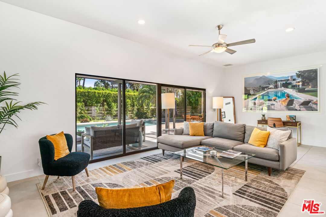 544 North Tercero Circle Palm Springs, CA 92262 - Photo 14 of 75 a outdoor living space with furniture and a large window