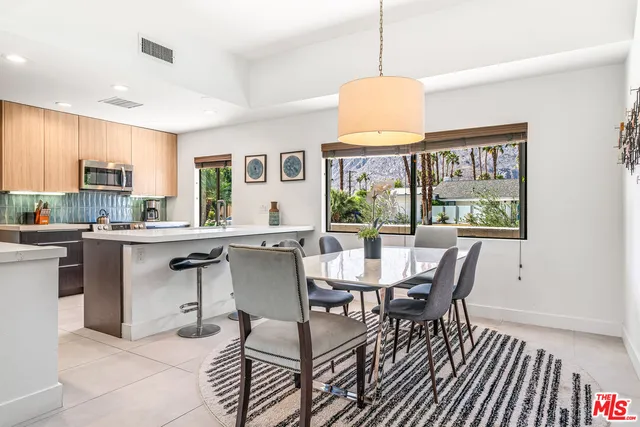 a kitchen with a stove a sink and a microwave