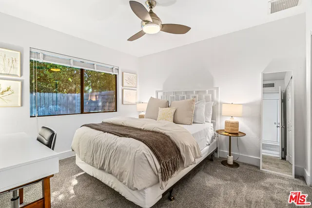 a front view of a house with a yard table and chairs