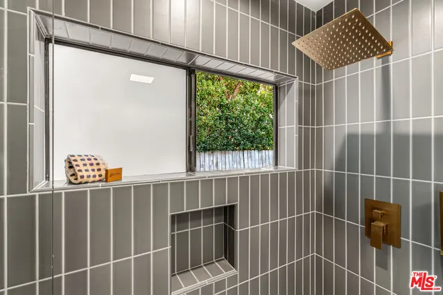 a view of a chairs and table in patio with a yard