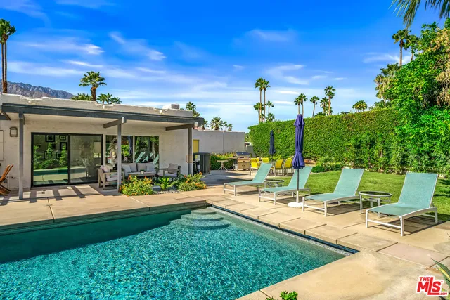 a view of a swimming pool with a garden