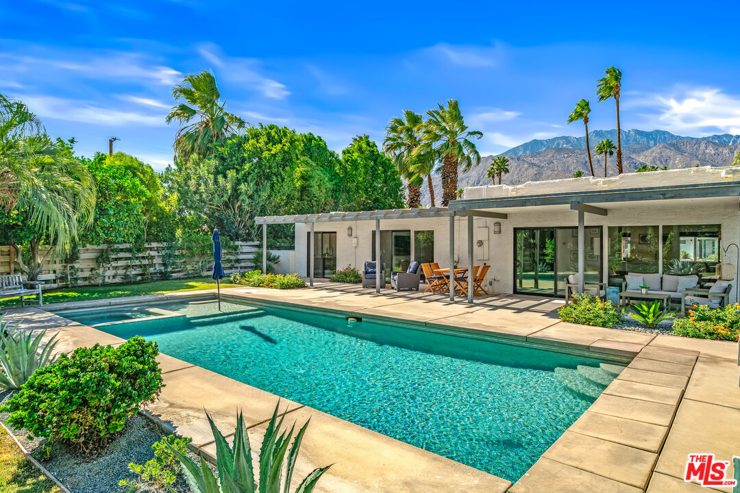544 North Tercero Circle Palm Springs, CA 92262 - Photo 50 of 75 a front view of a house with swimming pool having outdoor seating
