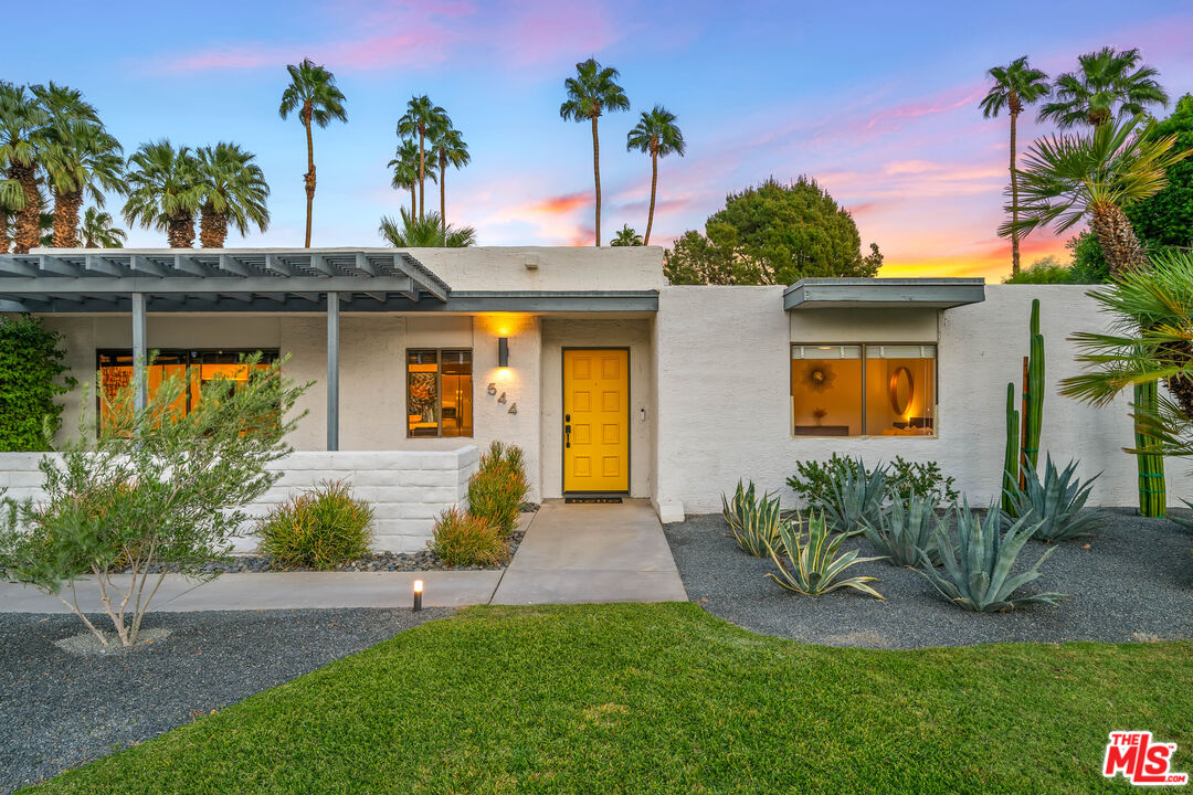 544 North Tercero Circle Palm Springs, CA 92262 - Photo 58 of 75 a front view of a house with garden