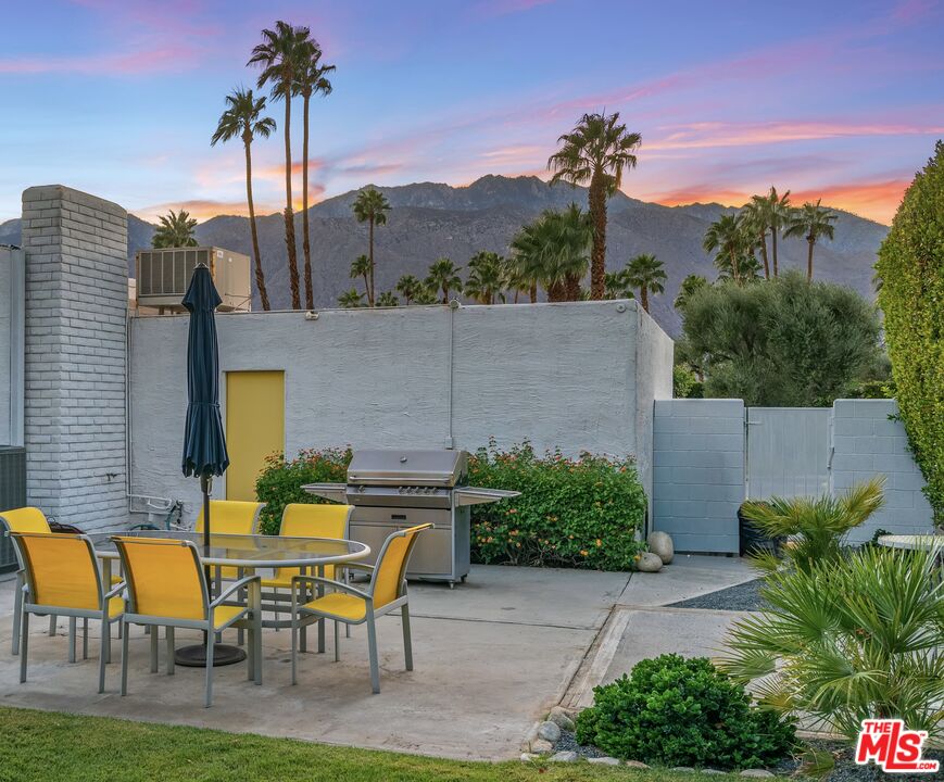 544 North Tercero Circle Palm Springs, CA 92262 - Photo 74 of 75 a backyard of a house with table and chairs