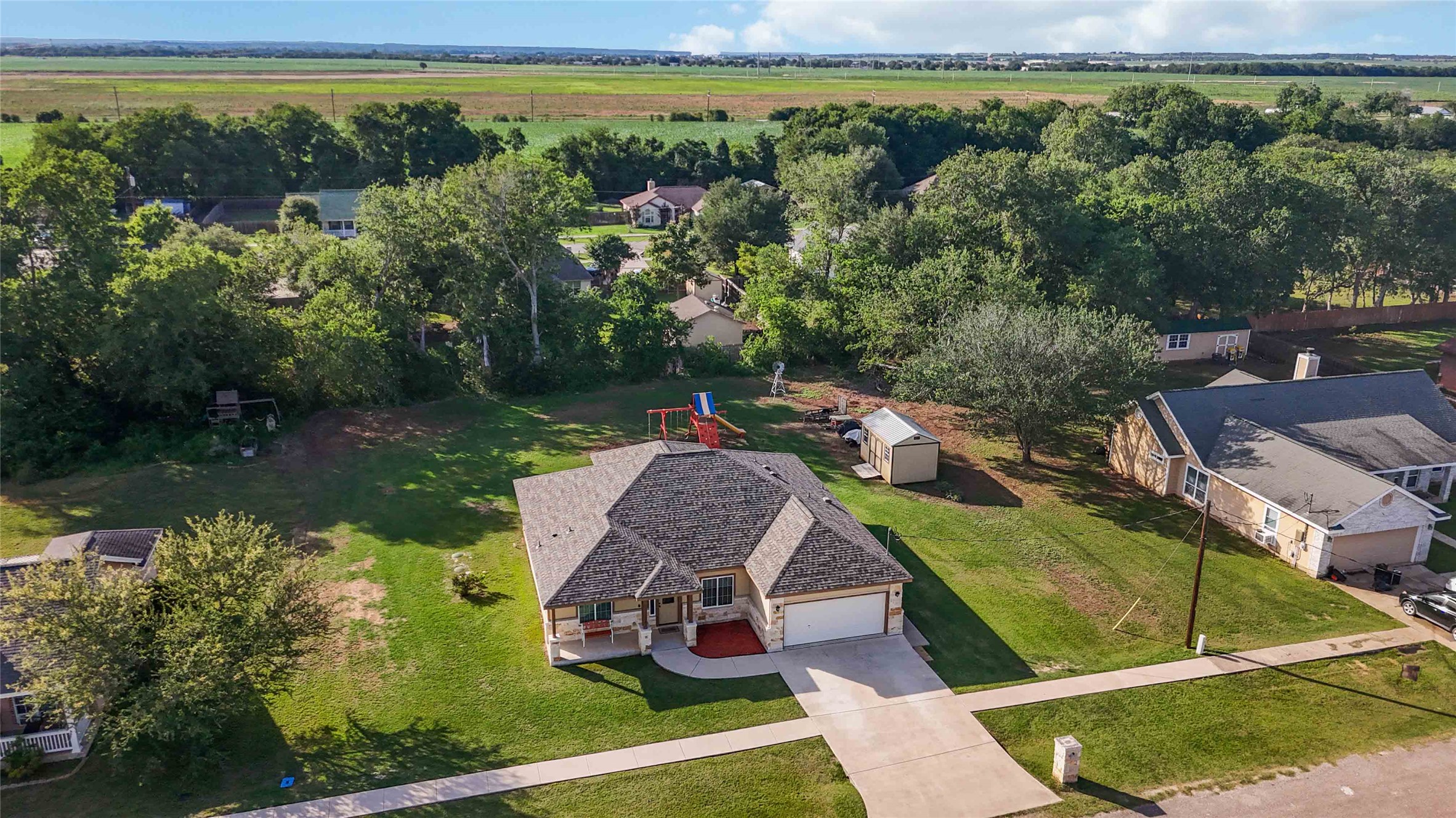 285 Hummingbird Way Martindale, TX 78655 - Photo 40 of 40 an aerial view of a house with a yard basket ball court and outdoor seating