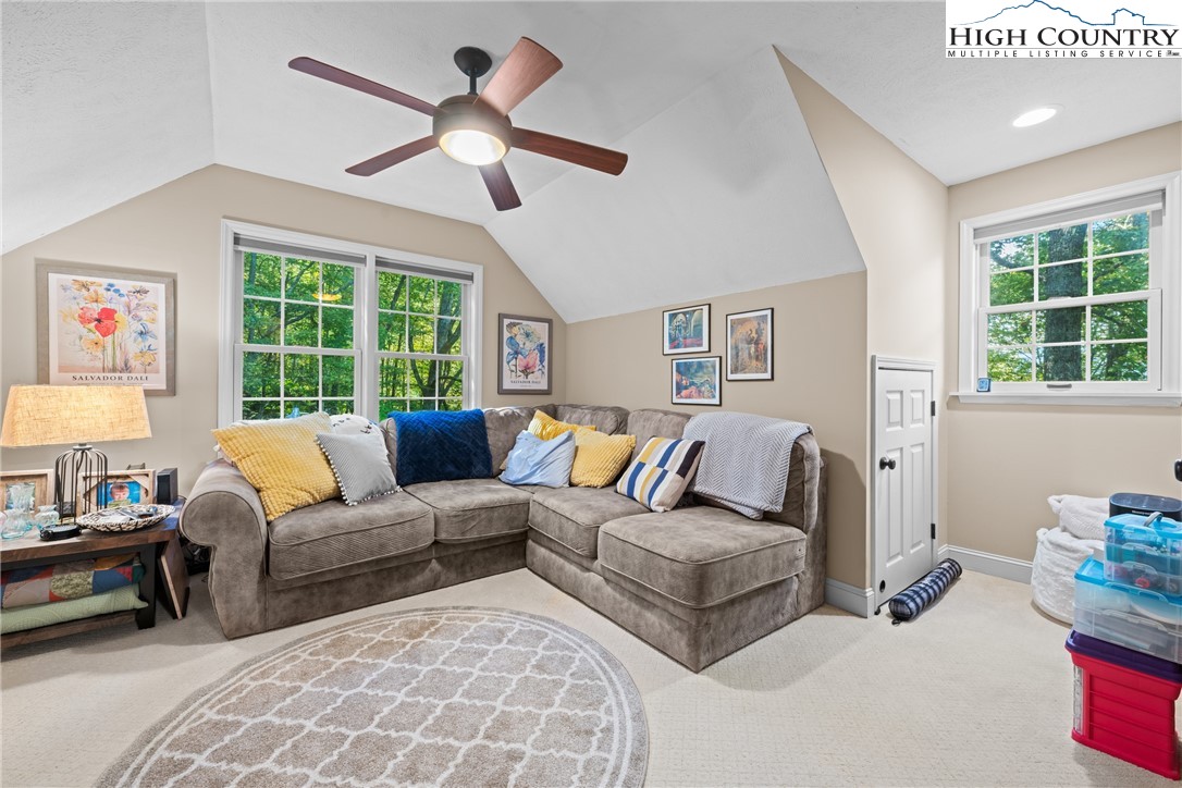 126 Moore Mountain Road Vilas, NC 28692 - Photo 13 of 43 a living room with furniture and a large window