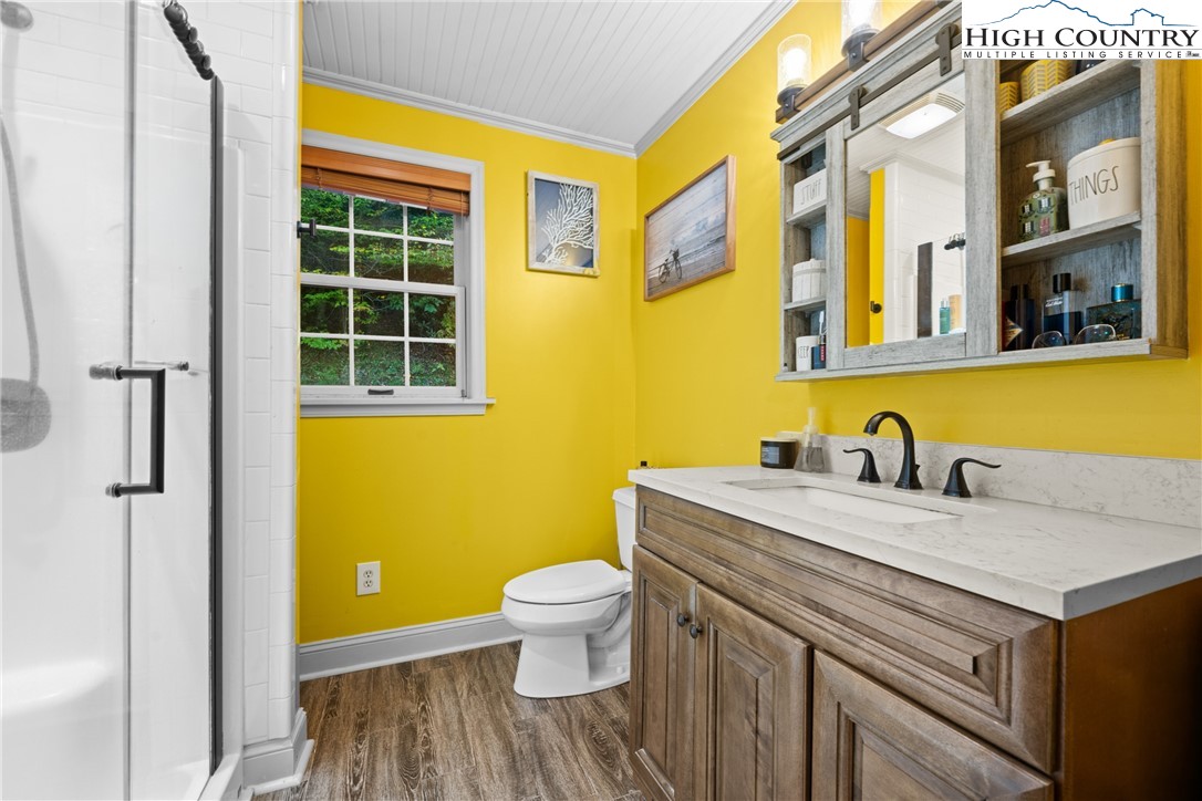 126 Moore Mountain Road Vilas, NC 28692 - Photo 23 of 43 a view of a bathroom with a sink and a toilet