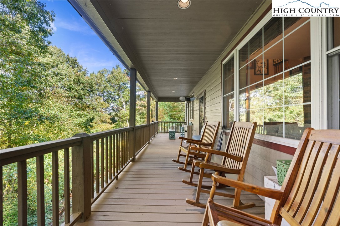 126 Moore Mountain Road Vilas, NC 28692 - Photo 25 of 43 a view of an chairs and table in the balcony