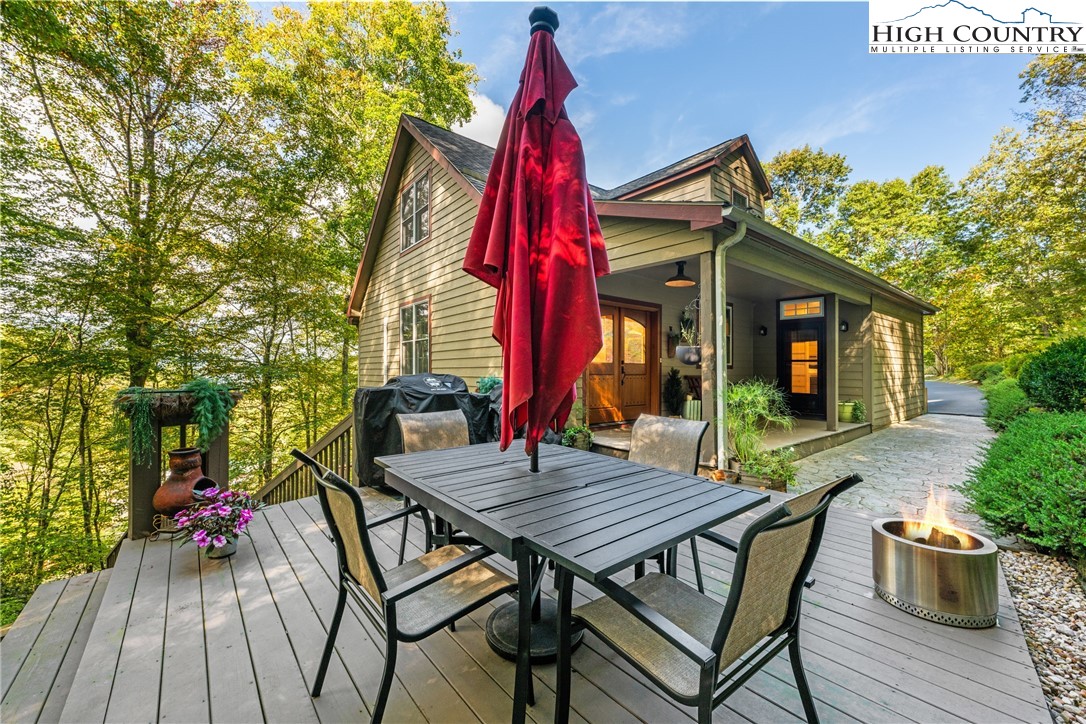 126 Moore Mountain Road Vilas, NC 28692 - Photo 36 of 43 a view of a house with backyard and sitting area