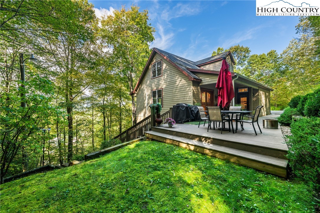 126 Moore Mountain Road Vilas, NC 28692 - Photo 37 of 43 a house view with a sitting space and garden