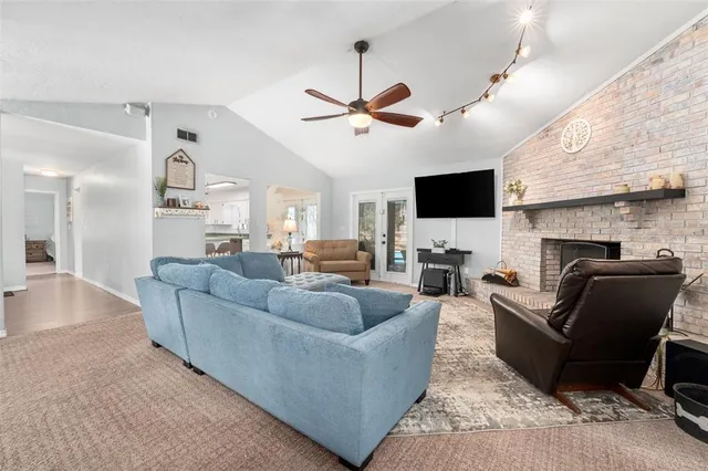 a living room with furniture and a fireplace