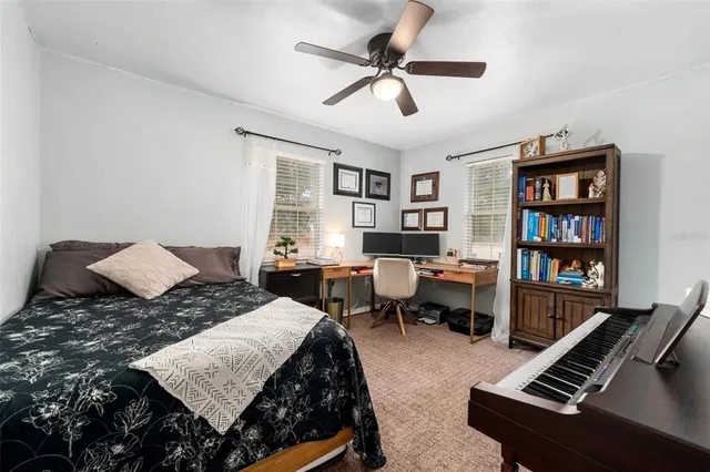 a bed room with a bed and a tv