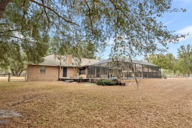 a view of a deck with table and chairs and wooden floor