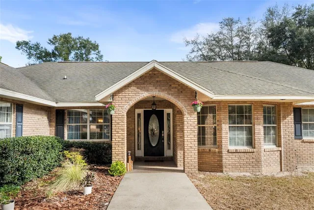 a view of pool with yard
