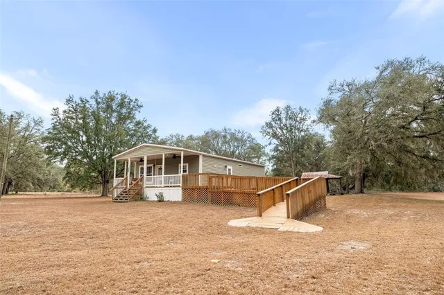 a view of balcony and yard