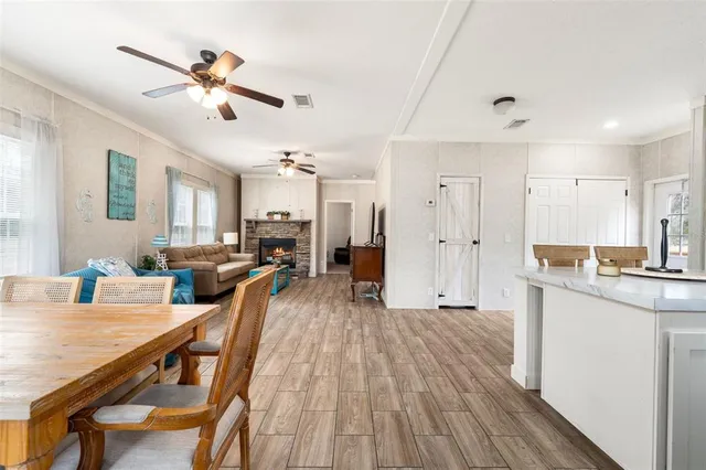a bedroom with a bed a couch and a chandelier