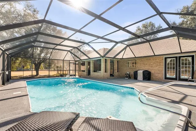 a view of a swimming pool with a patio