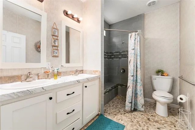 a view of a small house with a yard